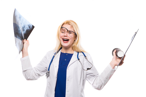 Female crasy funny doctor in white coat wear stethoscope and glasses hold clipboard and coffeecup and X-ray isolated on white background radiology scan anatomy busy schedule comic lot of work concept.