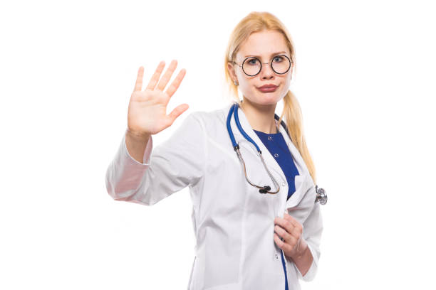 istock Woman doctor in white coat shows her palm 924254054