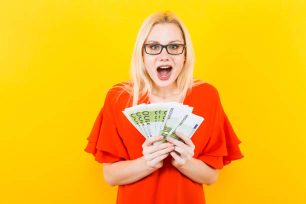istock Blonde woman with cash 924254116