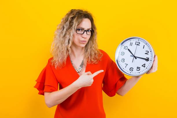 istock Woman in dress with clocks 924254180