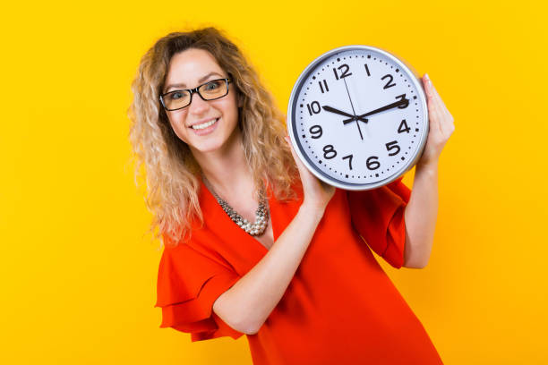 istock Woman in dress with clocks 924254186