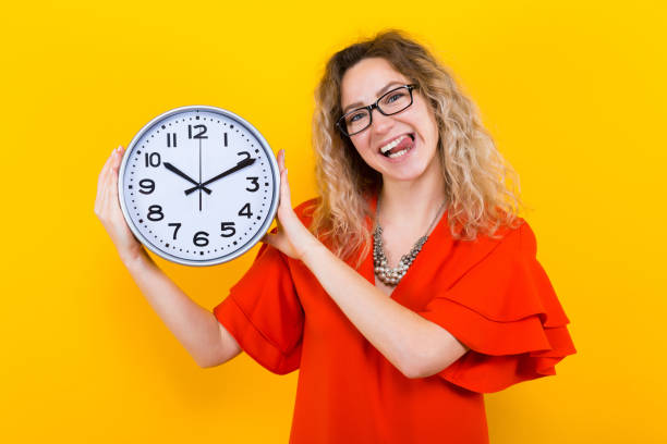 istock Woman in dress with clocks 924254200