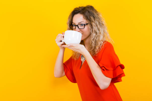 istock Woman in dress with cup 924254204
