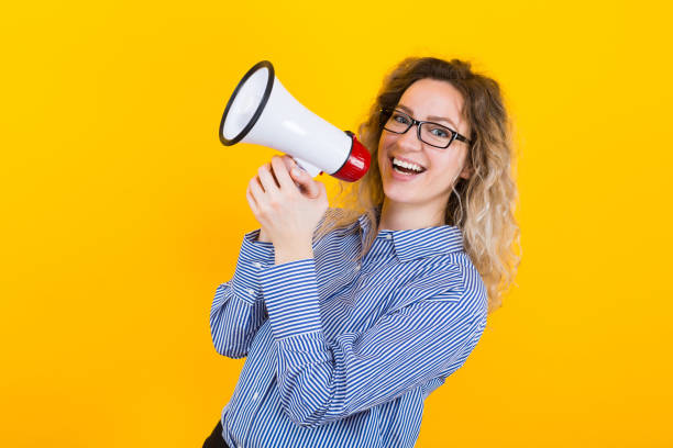 istock Woman in shirt with loudspeaker 924254244