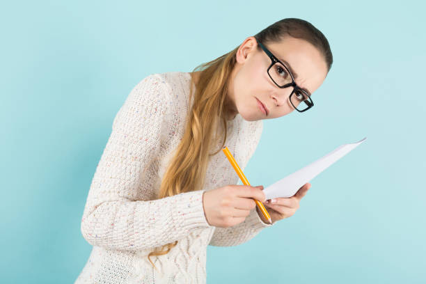 istock Attractive woman with ponytail and paper sheet 924256692