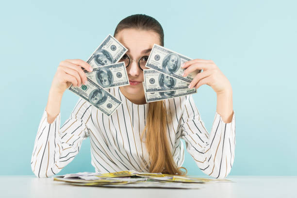 istock Attractive woman with cash 924256774