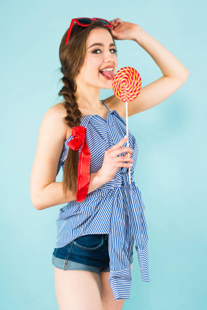istock Young sexy woman with lollipop 924256948