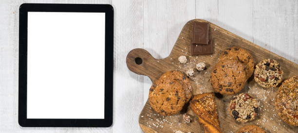 istock Fresh homemade cookies with tablet 924257498