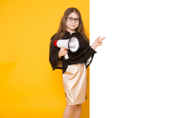 istock Little girl with white sign and loudspeaker 924257560
