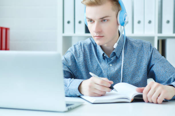 istock Young caucasian call center consultant with headset in office 924257902