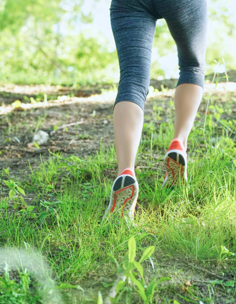 istock Image of female legs in sneakers. 924257974
