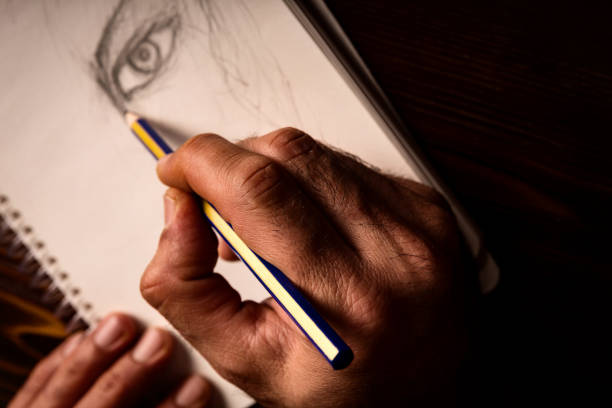 istock Artist's hand and sketch 924260218