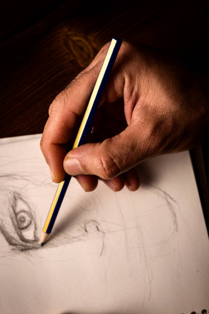 istock Artist's hand and sketch 924260254