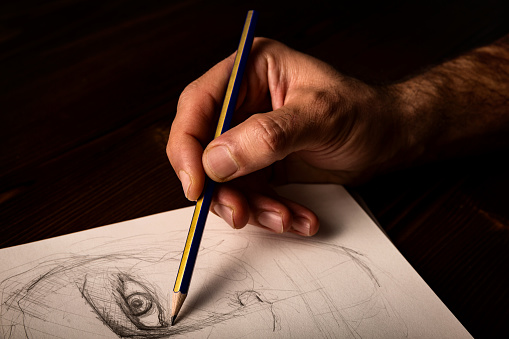Artist's hand and sketch