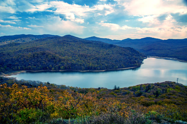 istock a large reservoir, top view. autumn forest and high blue sky, 924263846
