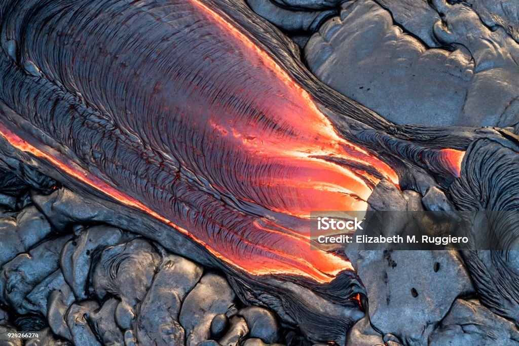 Aerial photos of volcano lava flow on Big Island of Hawaii Closeup aerial images shot from a helicopter of lava breakouts on slopes of the Pu’u’o’o vent In Hawaii Aerial View Stock Photo