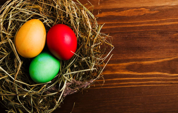 istock Easter eggs on a wooden background .Easter eggs of different colors .Easter eggs top view 924270434