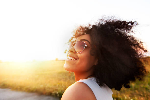 istock African woman enjoying vacations 924273046