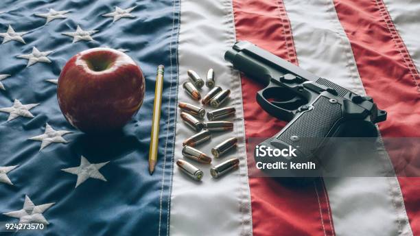 9mm Handgun In School Over Usa Flag Stock Photo - Download Image Now - Education, Flag, Gun