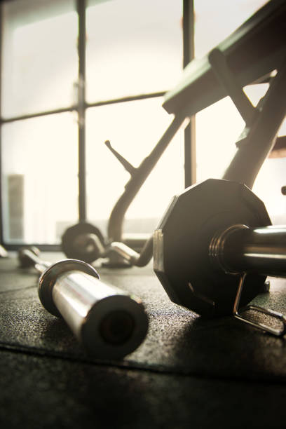 istock Barbell with weights on the floor in Gym 924276588