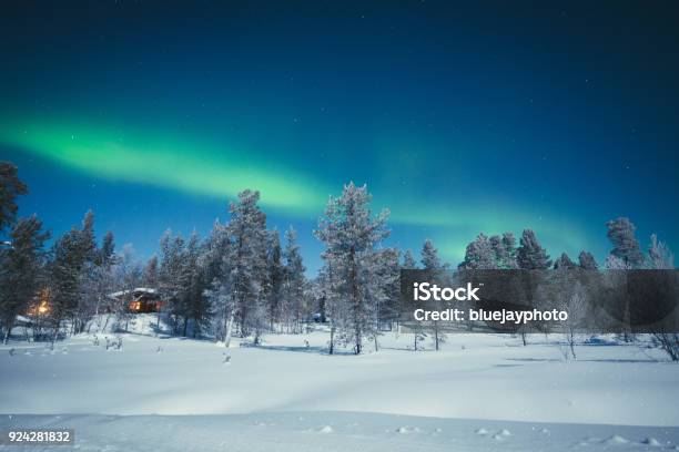 Aurora Borealis Over Winter Wonderland Scenery In Scandinavia Stock Photo - Download Image Now