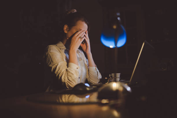istock Tired woman working late from home 924282306