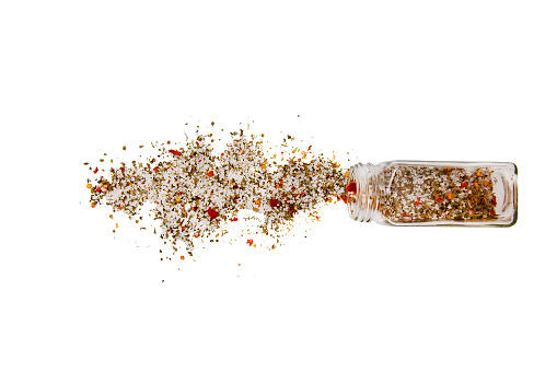 spilled salt and mix of pepper. Isolated on a white background.  top view, flat lay