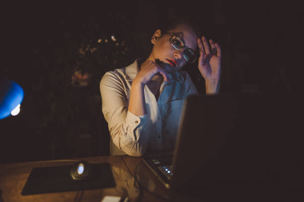 istock Tired woman working late from home 924282374