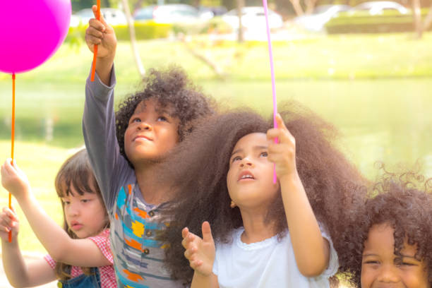 istock Kids Playing Cheerful with balloon Park Outdoors Concept 924290692