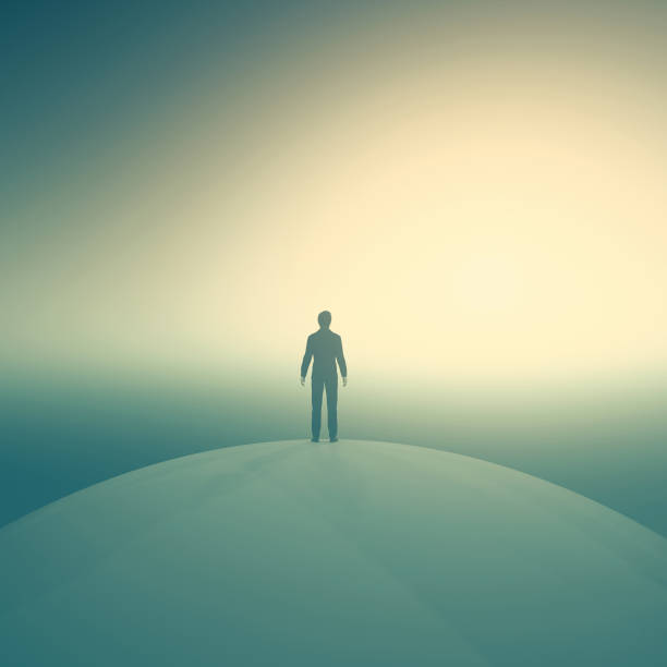 istock Sillouthe of a man standing on a globe looking at sunset. 924291544