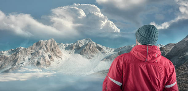 istock Hiker admire mountain scenery winter. 924291574