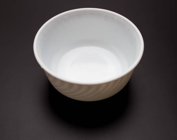 istock White plate for food on a black background 924304204