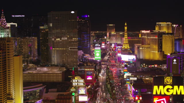 Low angle fly over Las Vegas Strip at night.