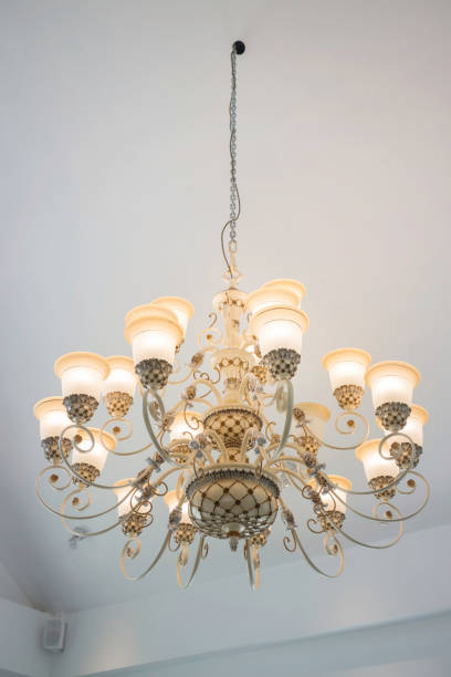 istock Vintage chandelier light bulb in dark room 924304430