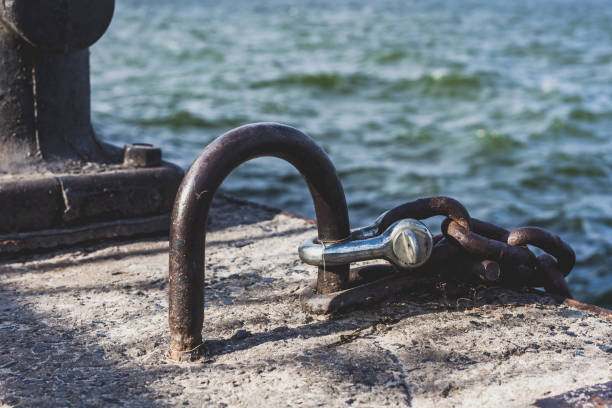istock Powerful metal mesh and concrete bollard on dock 924307512