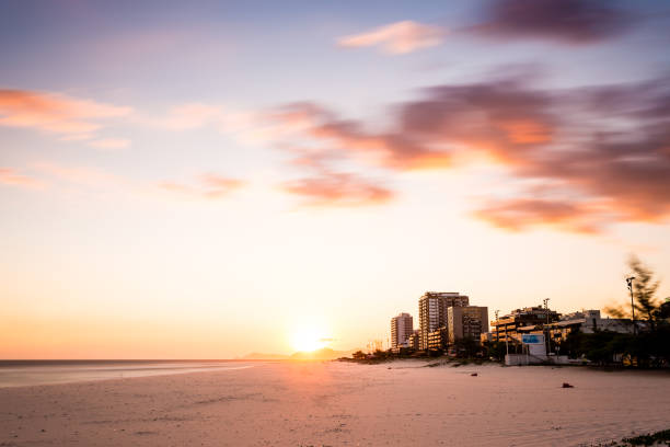Barra da Tijuca jetty beach on a beatiful afternoon. Log exposure. Rio de Janeiro