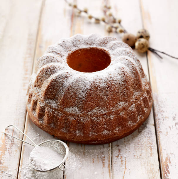 istock Easter yeast cake sprinkled with powdered sugar on a wooden white table 924330644
