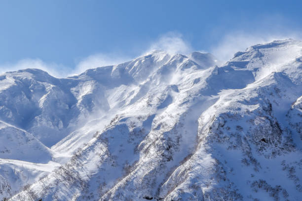 Backcountry skiing at Tokatidake,Kamifurano,Hokkaido,Japan Mt.Tokachi is an active volcano with an altitude of 2,077 m across Biei-cho and Kamifurano-cho in the central part of Hokkaido.
 furano basin stock pictures, royalty-free photos & images