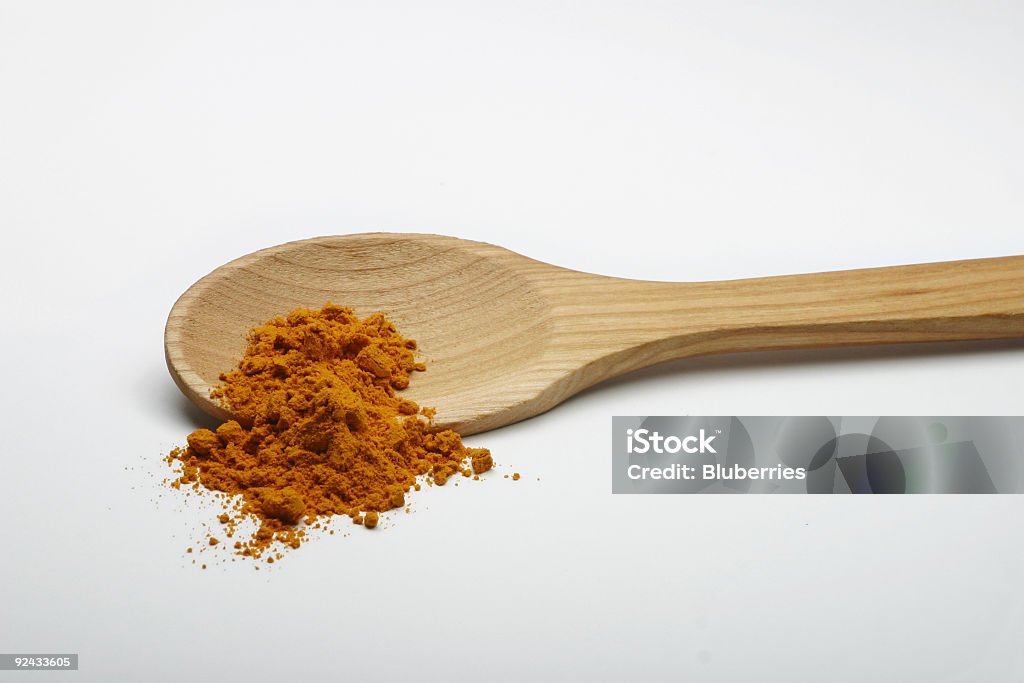 Curry auf einem hölzernen Löffel - Lizenzfrei Ausgedörrt Stock-Foto