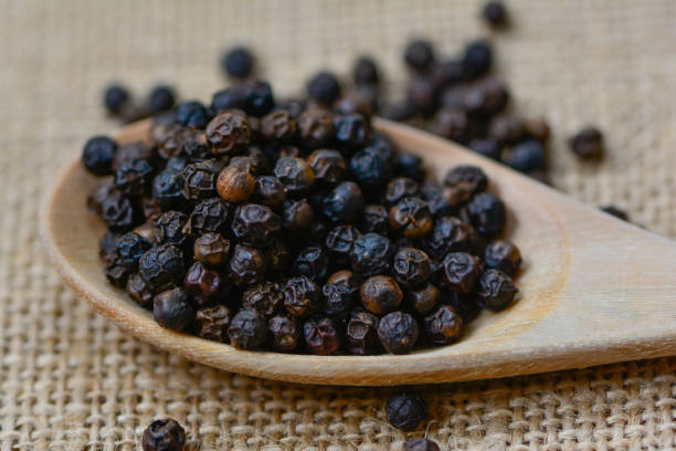 istock The black pepper on the wood. 924336712