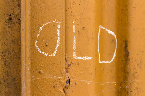 istock Word old handwriting with white chalk on old orange rusty metal background 924337072