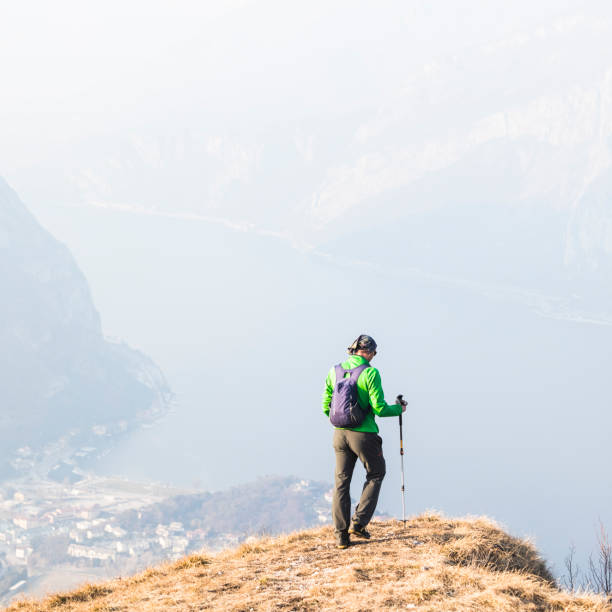 istock Hiker trekking on mountain over lake 924337108