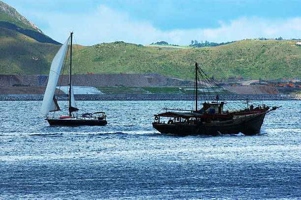 sail and fish boat stock photo
