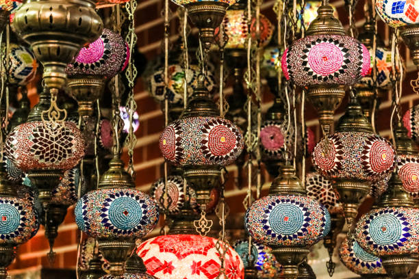 istock Traditional bright decorative hanging Turkish lights and colourful light lamps with vivid colours  in Turkey Pavilion, Global Village, Dubai, United Arab Emirates 924340992