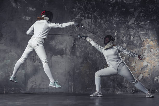 istock Two women fencing 924341056