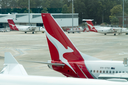 Qantas Airline Aircraft at the Sydney International Airport, seen during a hot day in the summer.