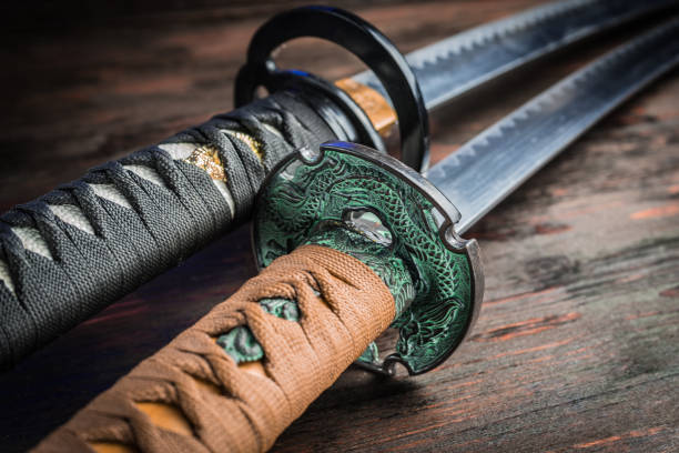 Sword of the samurai. Medieval Japanese weapons. Sword of the samurai. Medieval Japanese weapons. Sword of the samurai. Medieval Japanese weapons. black shawl wrap stock pictures, royalty-free photos & images