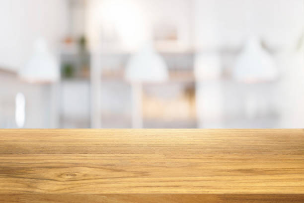 istock Beautiful empty wooden table and white modern kitchen cafe background 924343962