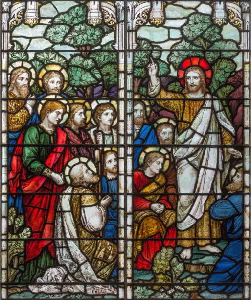 London -  The Apparition of resurrected Jesus to apostle on the stained glass in church Holy Trinity Brompton.