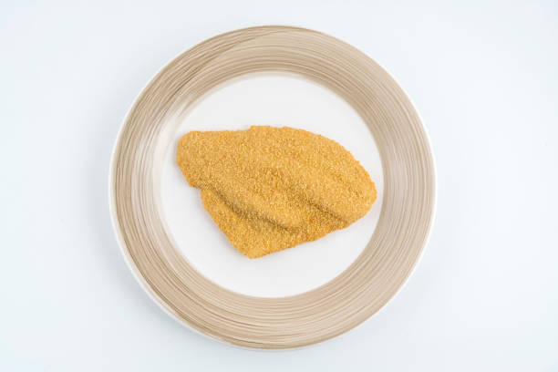 a fillet of plaice breaded frozen on the plate